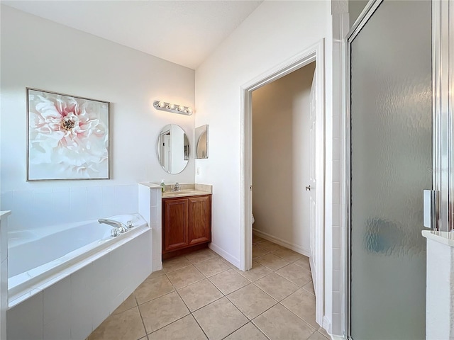 full bathroom featuring toilet, tile patterned floors, plus walk in shower, and vanity