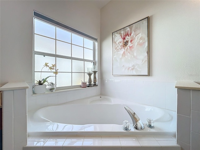 bathroom featuring tiled bath