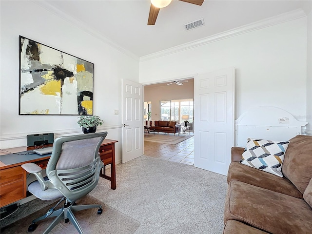 carpeted office space with ornamental molding and ceiling fan