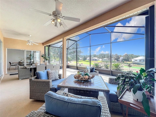 sunroom / solarium with ceiling fan