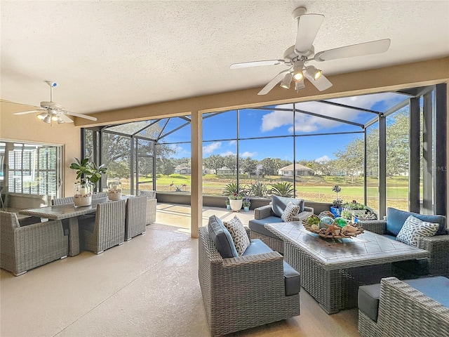 sunroom / solarium with ceiling fan and a healthy amount of sunlight