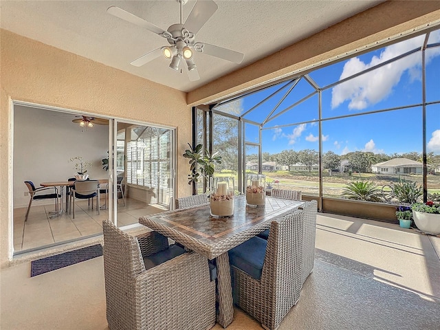 sunroom / solarium with ceiling fan