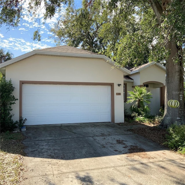 ranch-style home featuring a garage