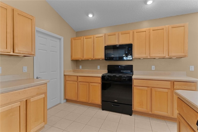 kitchen featuring light tile patterned floors, a textured ceiling, light brown cabinetry, and black appliances