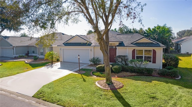 ranch-style home featuring a garage and a front lawn