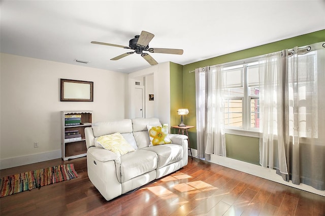 living room featuring hardwood / wood-style flooring and ceiling fan