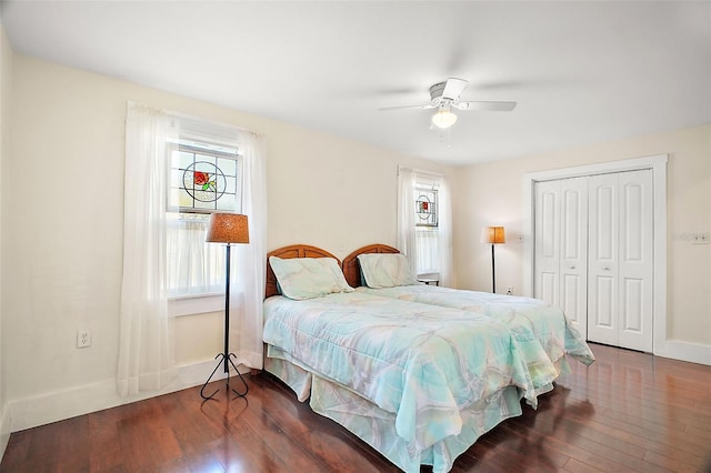 bedroom featuring a closet, dark hardwood / wood-style floors, and ceiling fan