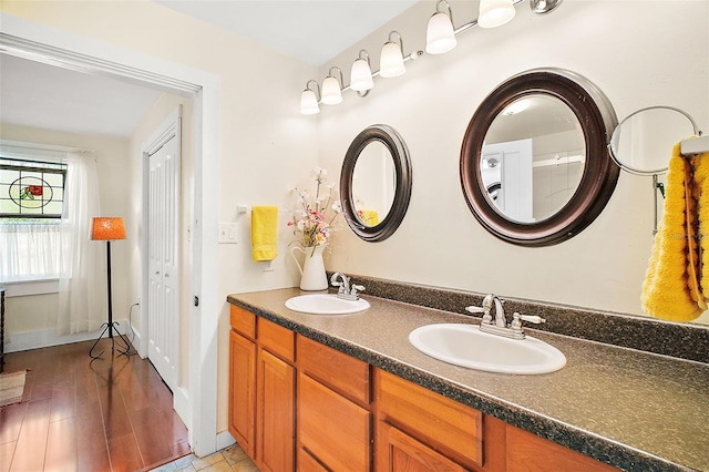 bathroom featuring vanity and wood-type flooring