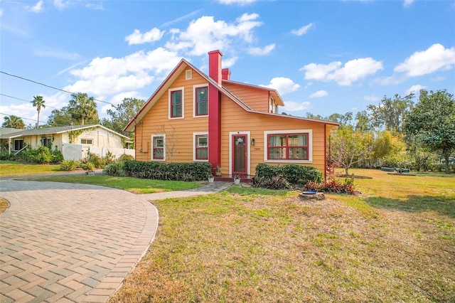 view of front of home with a front lawn