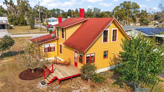 back of house featuring a deck