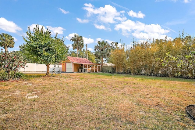 view of yard with an outbuilding and a garage