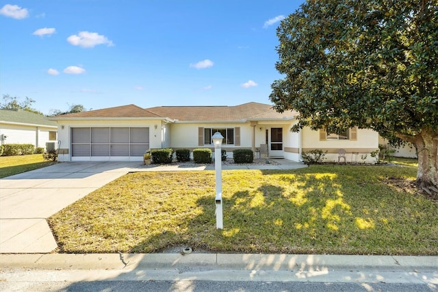 single story home with a garage and a front yard