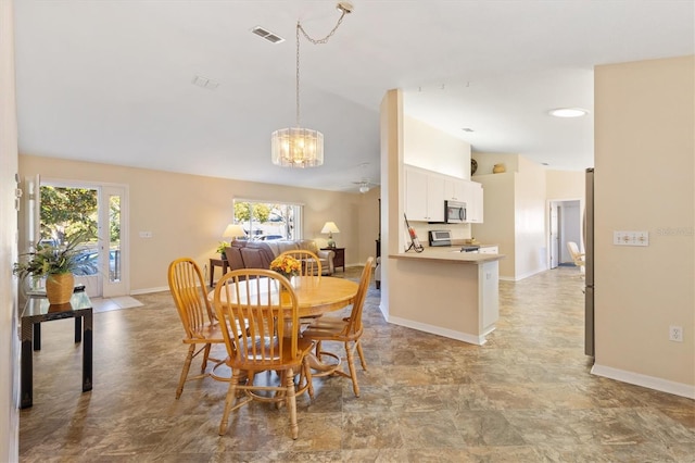 dining space with ceiling fan