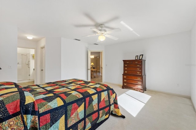 carpeted bedroom with ceiling fan and ensuite bathroom