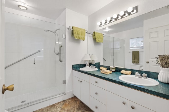 bathroom featuring vanity, toilet, and walk in shower