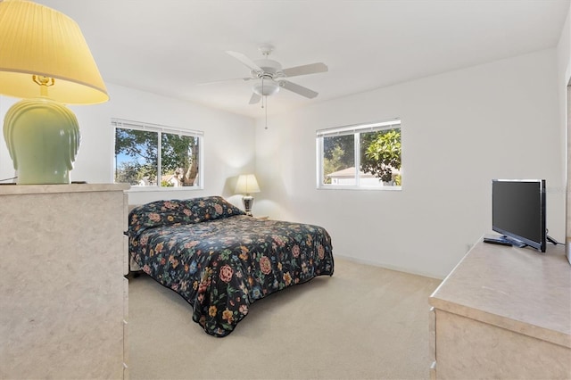 carpeted bedroom featuring ceiling fan