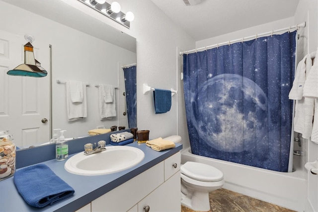 full bathroom featuring shower / bath combo, vanity, and toilet