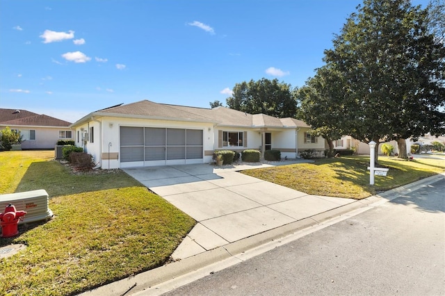 ranch-style house with a garage and a front lawn