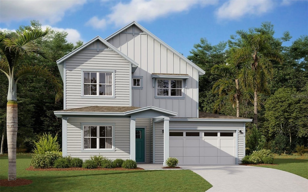 view of front of home featuring a garage and a front lawn