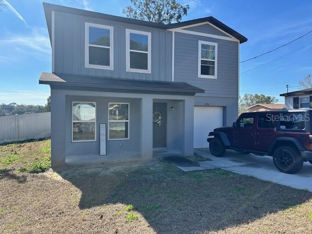 view of front of home featuring a porch and a garage