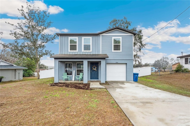 view of property featuring a garage, a porch, and a front yard