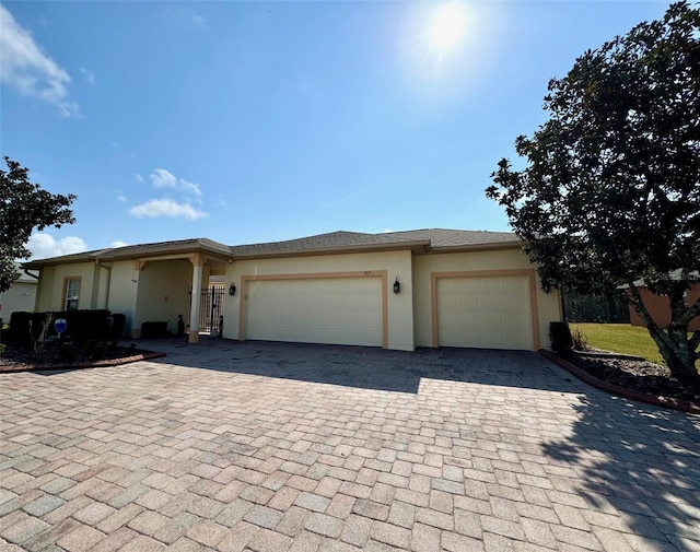 view of front of property with a garage