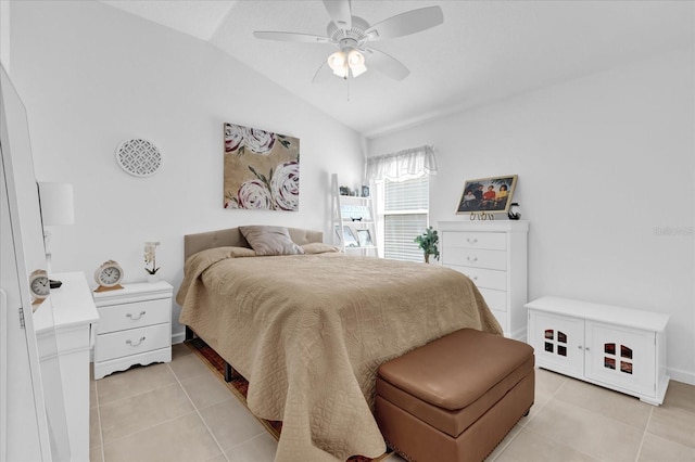 tiled bedroom featuring vaulted ceiling and ceiling fan