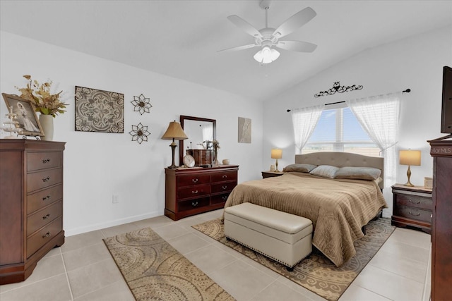 tiled bedroom featuring lofted ceiling and ceiling fan