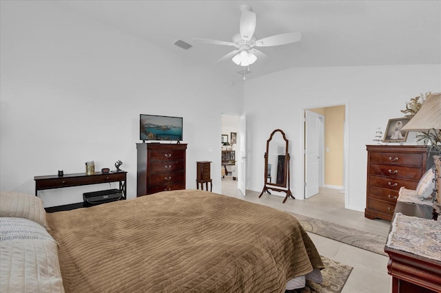 bedroom featuring ceiling fan, vaulted ceiling, and light tile patterned floors