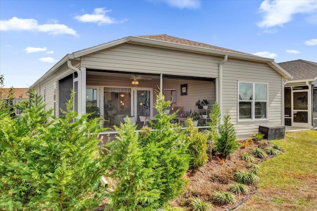 view of front of property with a front lawn and a sunroom