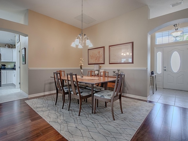 dining room featuring an inviting chandelier and light hardwood / wood-style floors