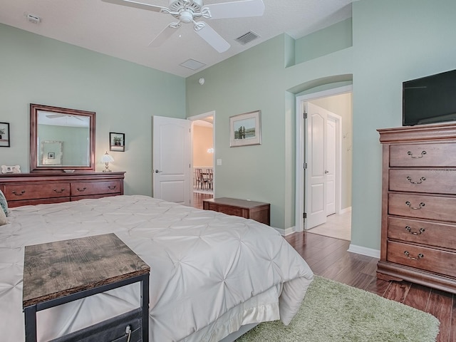 bedroom featuring ceiling fan and dark hardwood / wood-style flooring