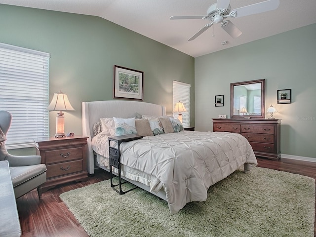 bedroom featuring lofted ceiling, dark hardwood / wood-style floors, and ceiling fan