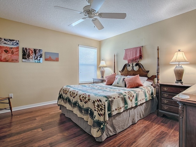 bedroom with ceiling fan, dark hardwood / wood-style floors, and a textured ceiling