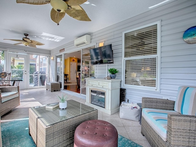 view of patio with ceiling fan, an outdoor living space with a fireplace, french doors, and a wall mounted AC