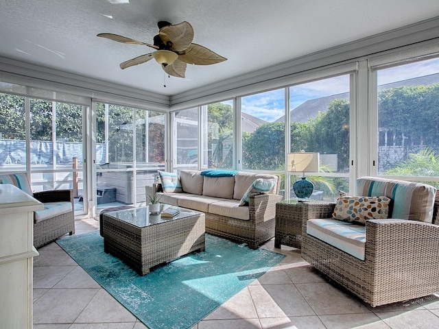 sunroom / solarium featuring a mountain view and ceiling fan