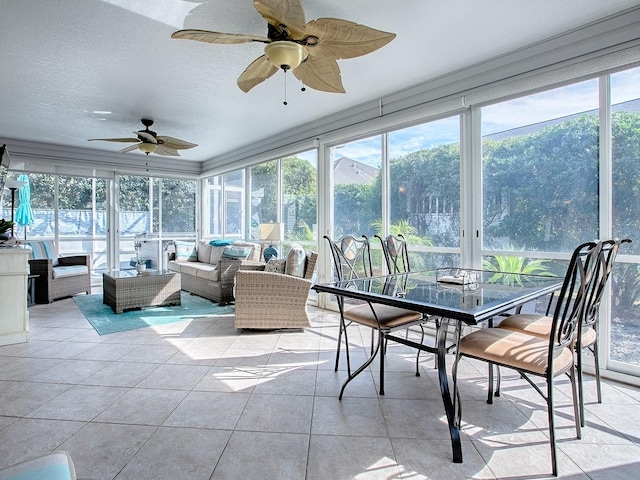 sunroom / solarium with ceiling fan