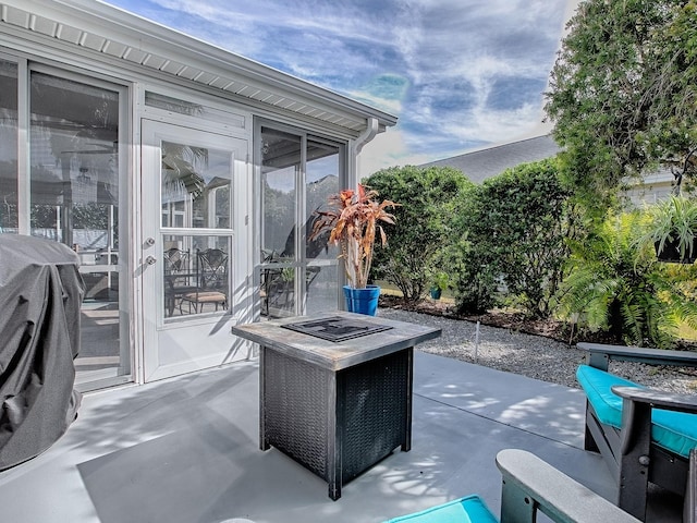 view of patio with a fire pit