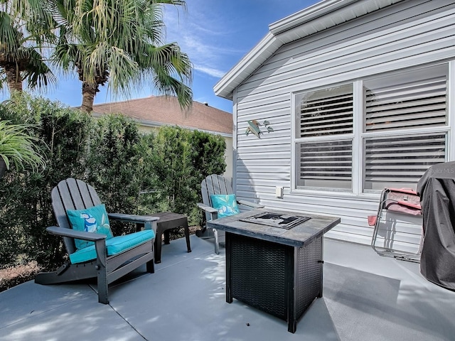 view of patio with a fire pit