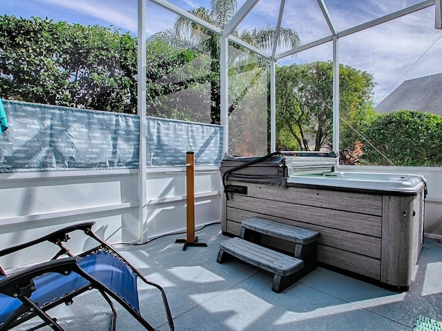 exterior space featuring a hot tub and glass enclosure