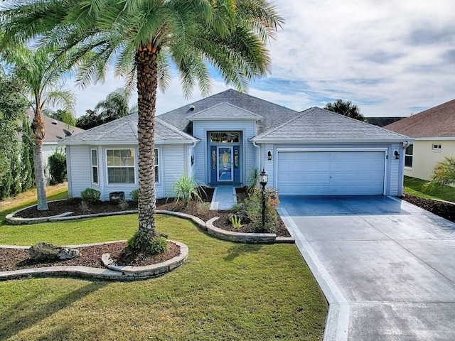 single story home with a garage and a front yard