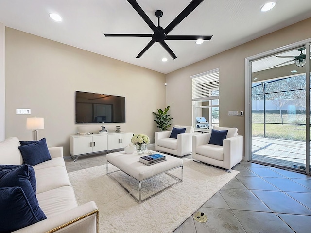 living room with light tile patterned flooring and ceiling fan