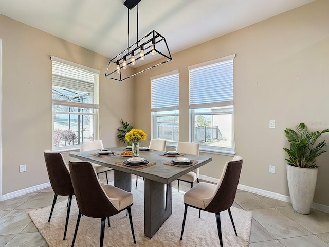 tiled dining area with a healthy amount of sunlight