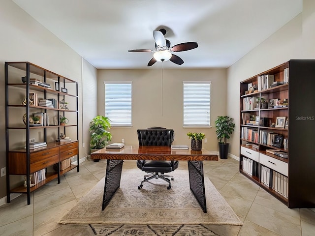 office space with plenty of natural light, ceiling fan, and light tile patterned floors