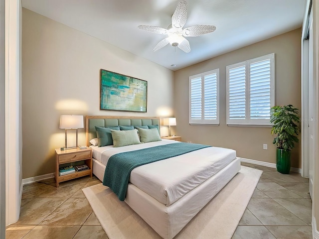 bedroom featuring ceiling fan and light tile patterned floors