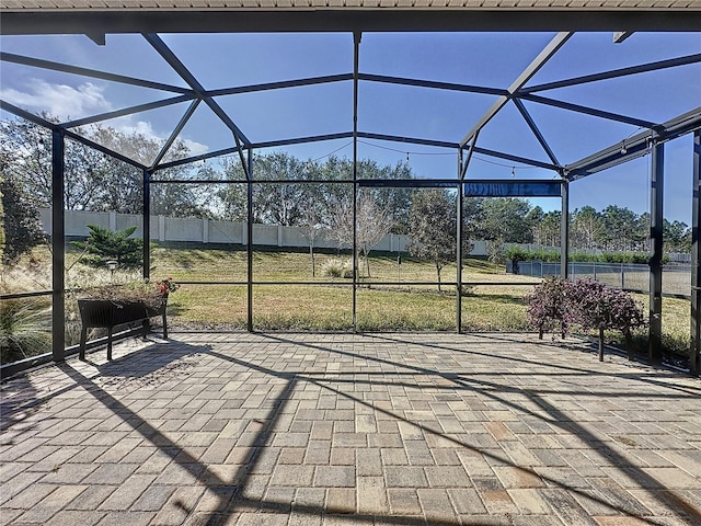 view of patio with glass enclosure