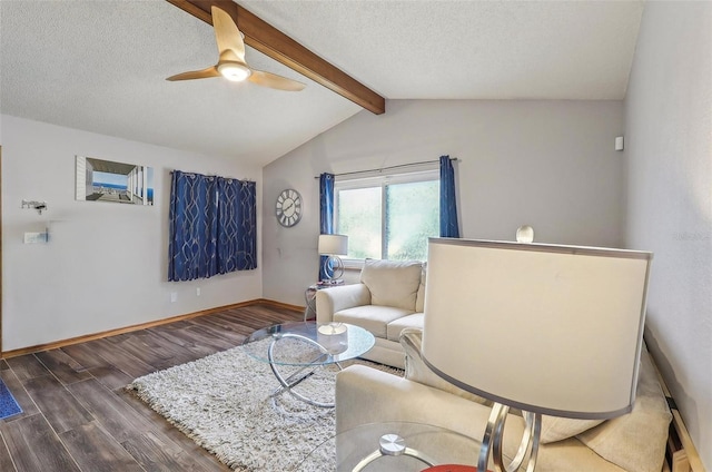 living area featuring lofted ceiling with beams, ceiling fan, a textured ceiling, and dark hardwood / wood-style flooring