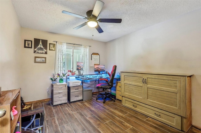 office space featuring a textured ceiling and ceiling fan