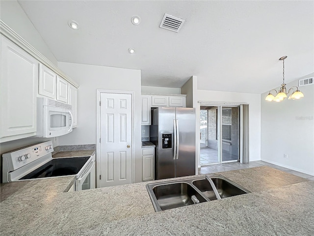 kitchen featuring sink, white appliances, a notable chandelier, and white cabinets