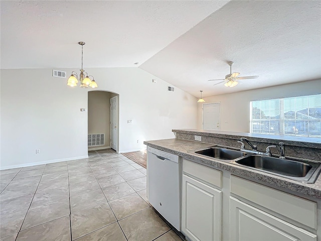 kitchen with lofted ceiling, sink, white dishwasher, white cabinets, and ceiling fan with notable chandelier